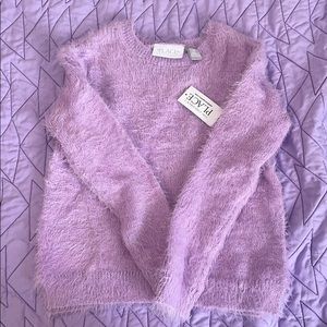 Girl’s fuzzy sweater